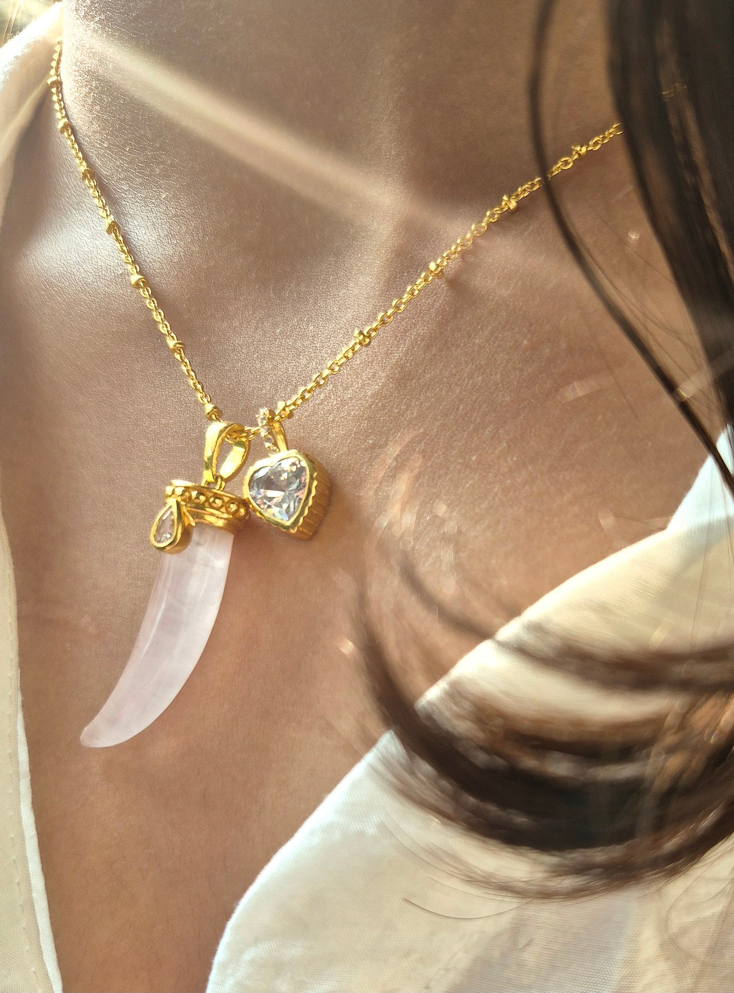 rose quartz horn pendant with heart